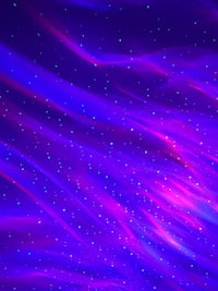 a purple and blue background with stars