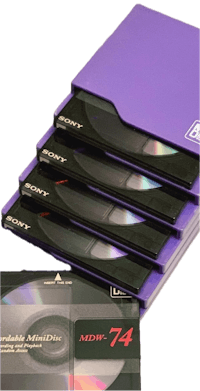 a purple cd holder with four cds in it